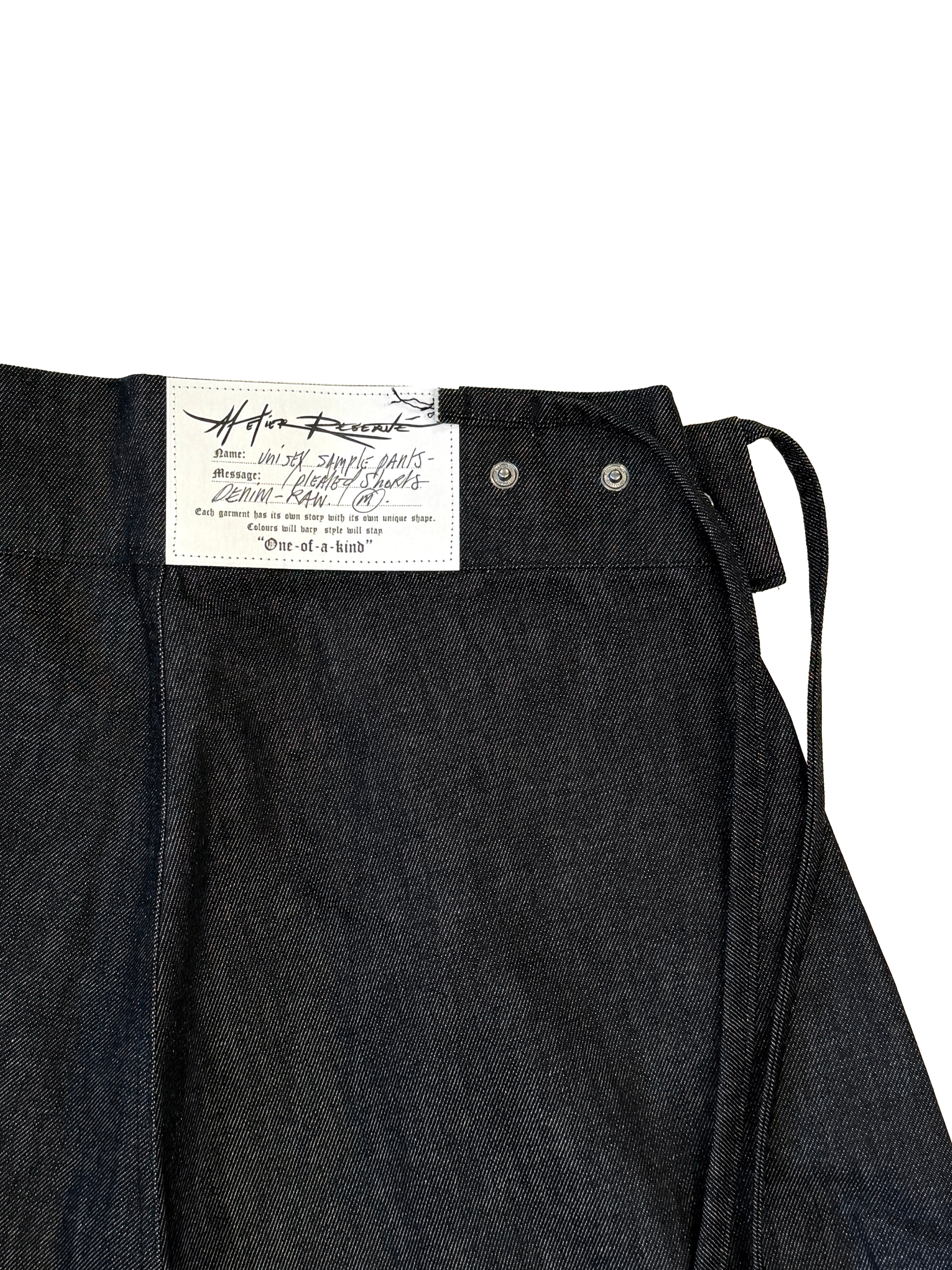 PLEATED RAW DENIM SHORTS